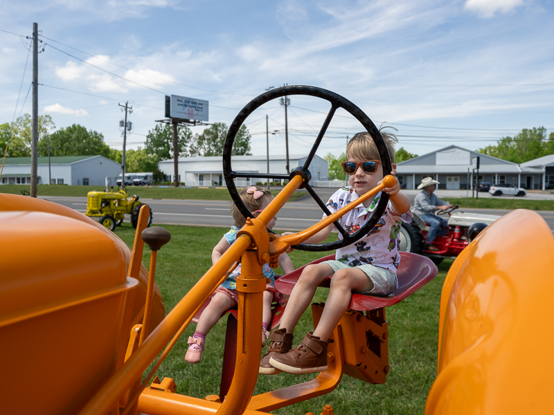 Kids on a antique tractor